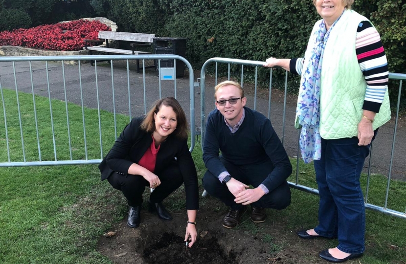 Victoria Prentis MP planting one of the trees at Garth Park with Councillors Jason Slaymaker and Lynn Pratt
