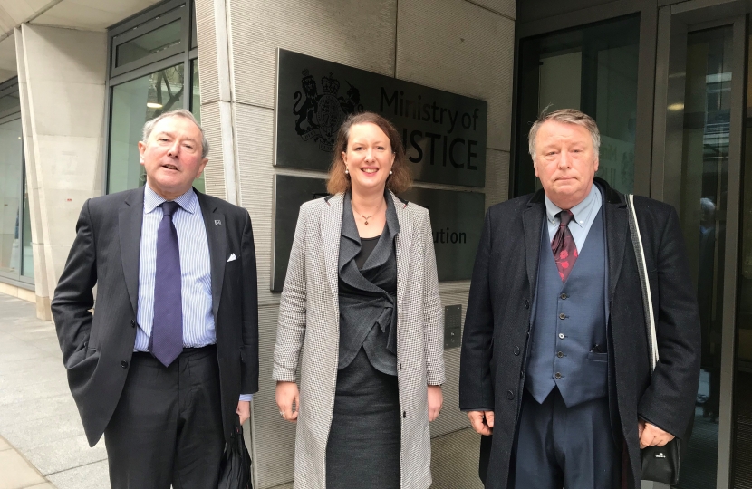 of Victoria Prentis MP outside the Ministry of justice with James Macnamara (left) and George Green (right)